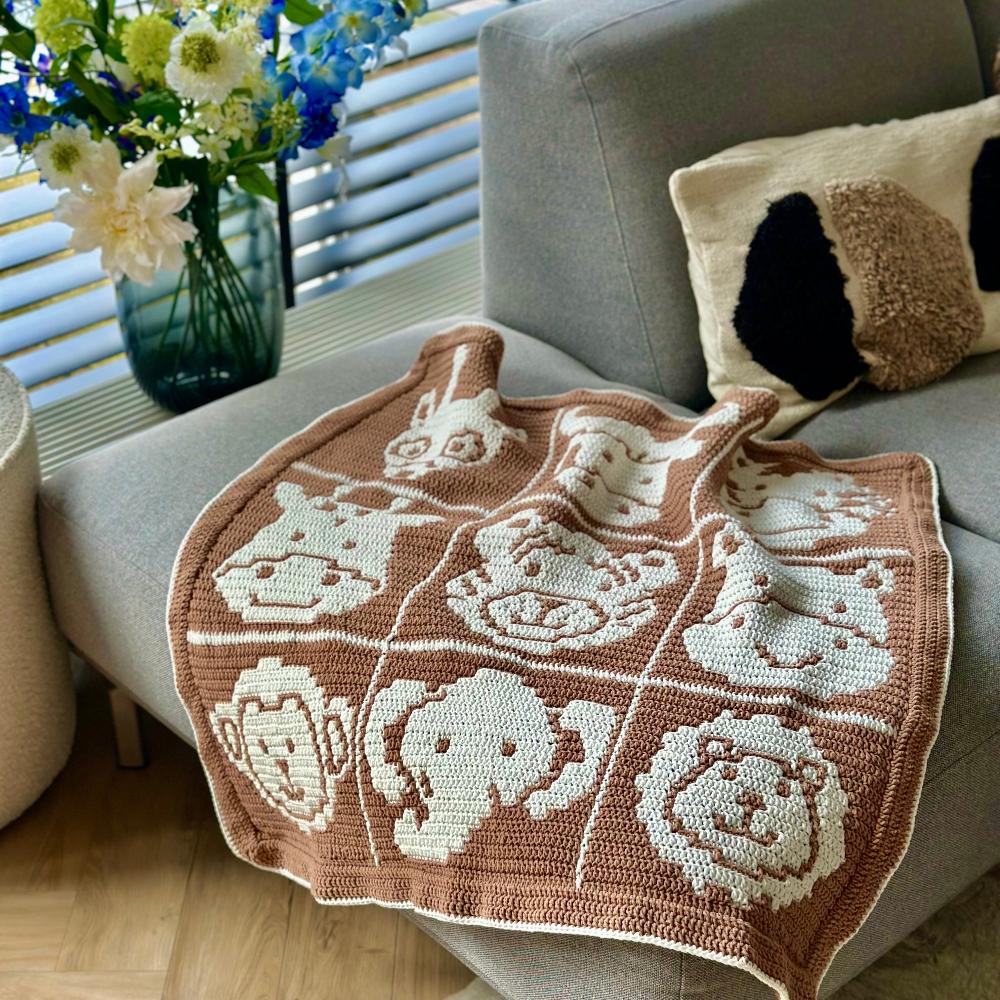 Overlay Mosaic Crochet Pattern - Safari Animals Baby Box Blanket on couch 2