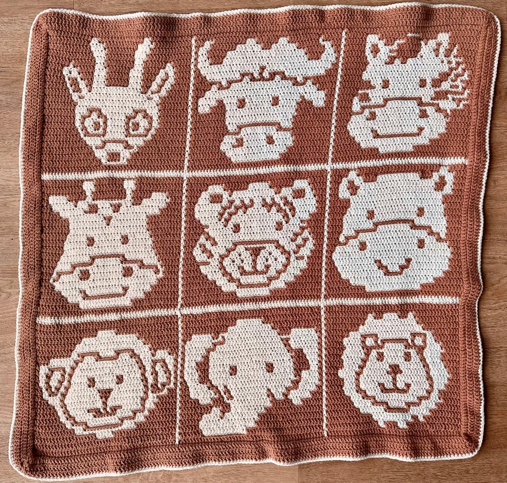 Overlay Mosaic Crochet Pattern - Safari Animals Baby Box Blanket on floor